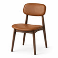 Chaise rétro en bois brun foncé avec assise aspect cuir cognac, 52 × 57 × 82 cm